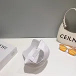 White, Grey and Black Caps Prada